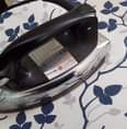 May be an image of clothes iron and indoor