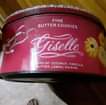 May be an image of text that says 'FINE BUTTER COOKIES Giselle KIES OF: COCONUT, VANILLA, BUTTER, LEMON, RAISINS'